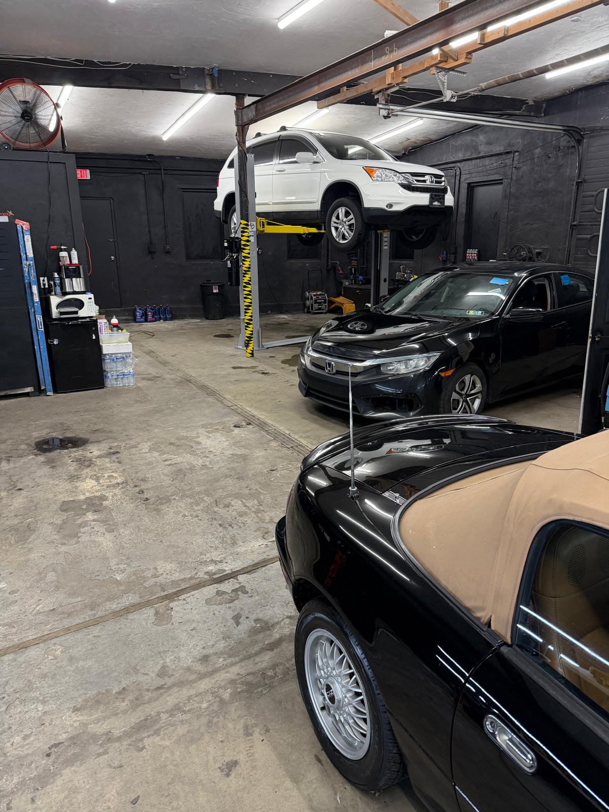 Black Mazda Miata after paint correction in our Waltham shop